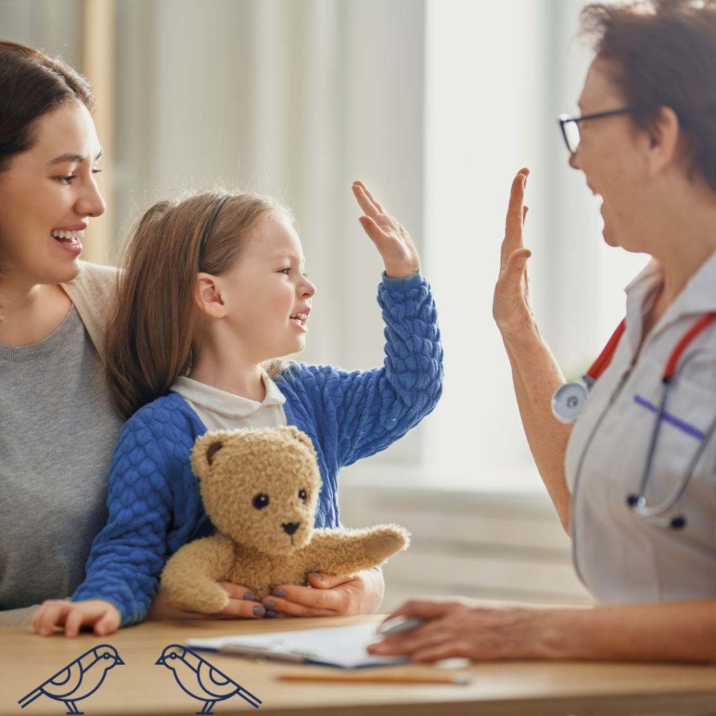 A child with her mother high-fiving a doctor, completing her check ups for back to school in France, called la rentrée